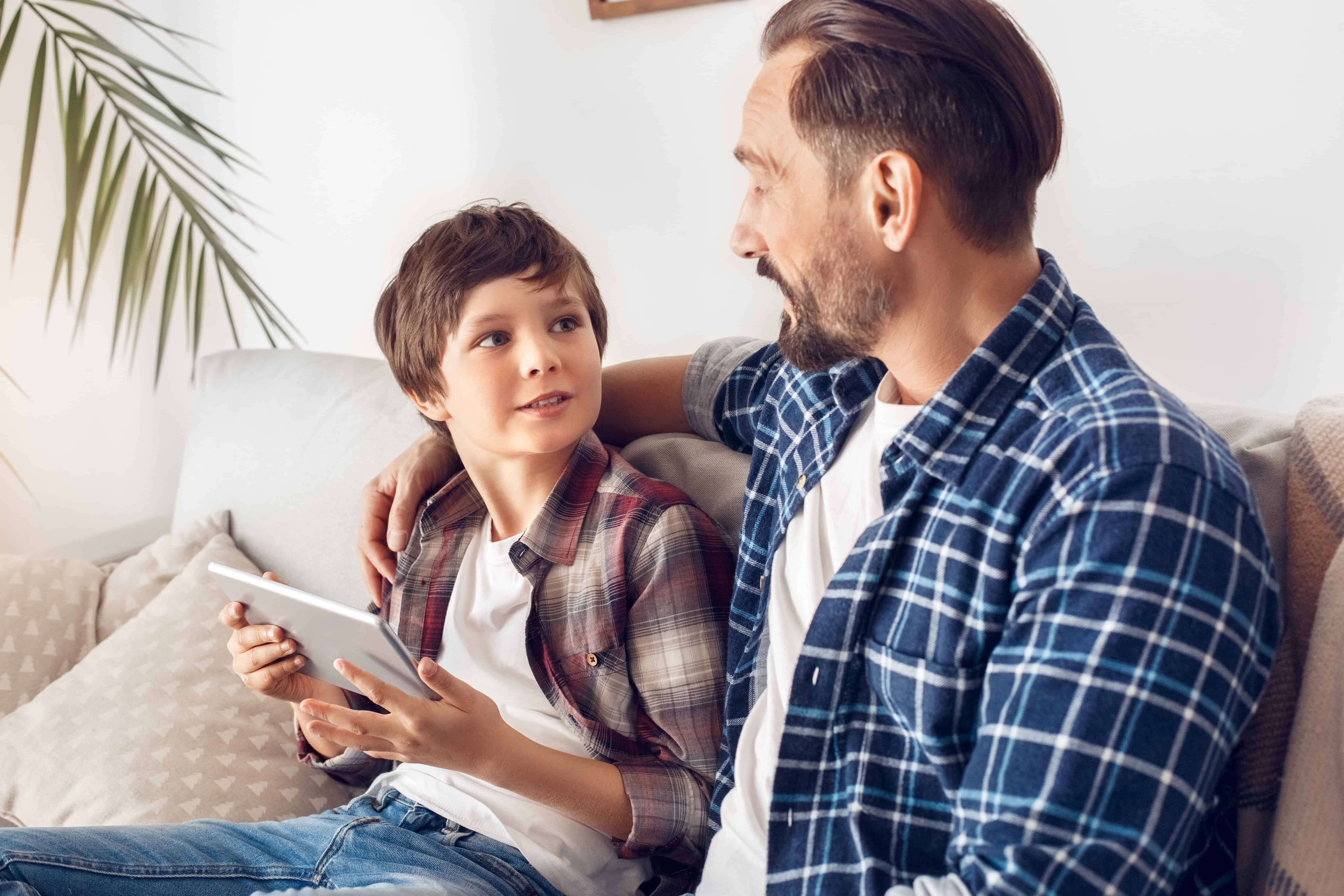 Parent talking with child about online safety