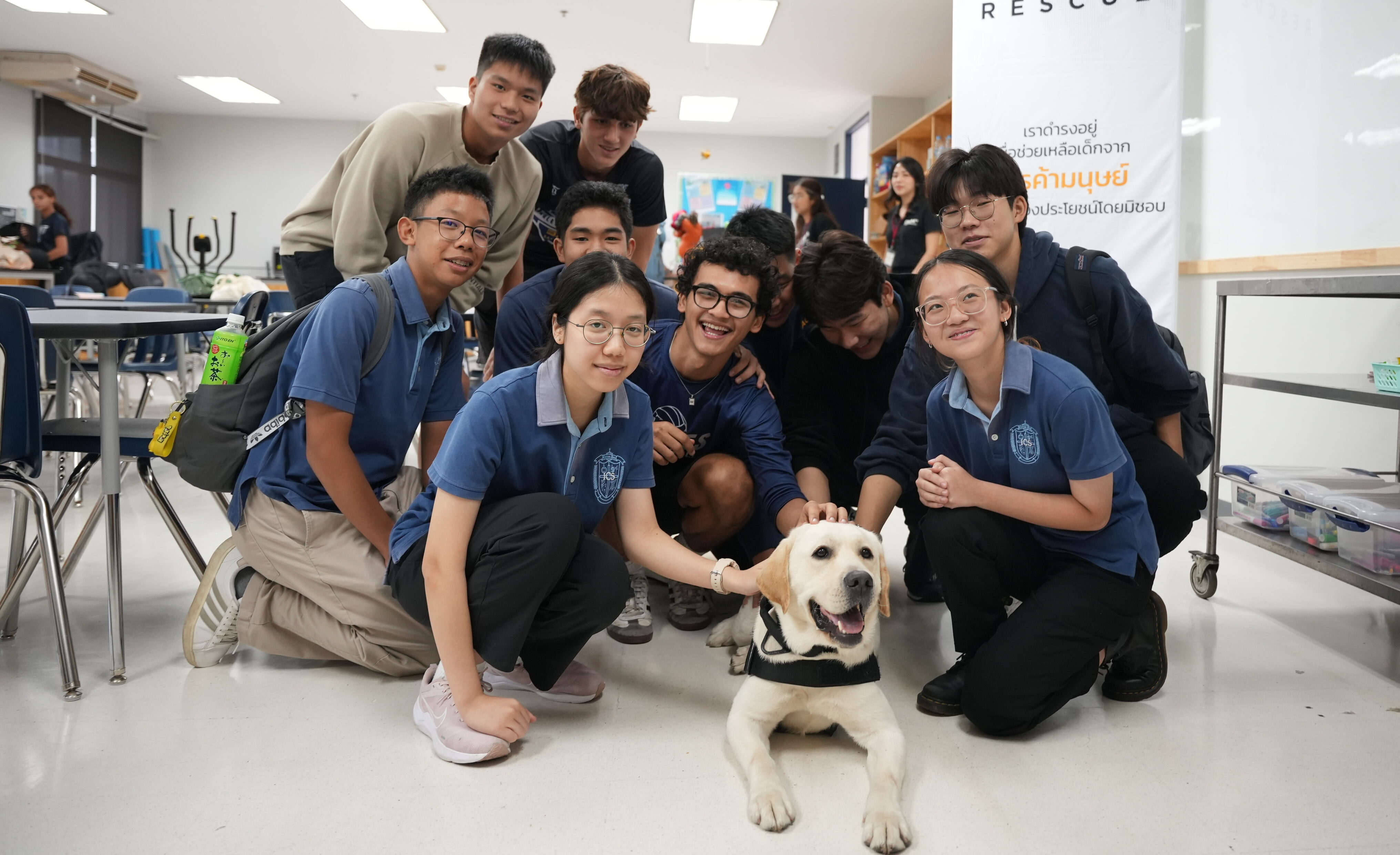 Kids together with K9 dog