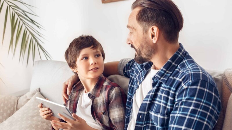 Parent talking with child about online safety